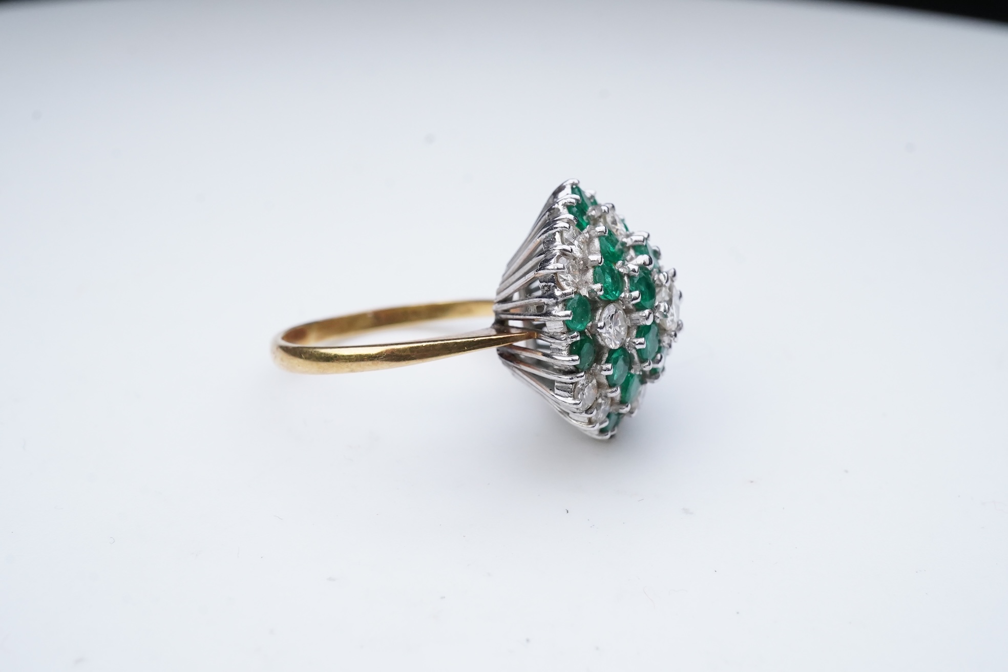 An emerald and diamond cocktail ring